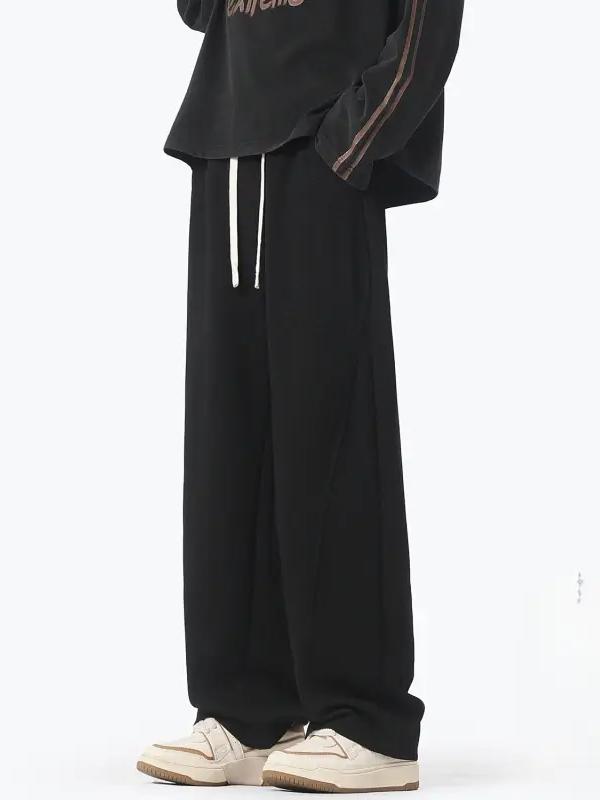 推荐商品：WAALEVANA 美式重磅弯刀解构复古垂感抗皱阔腿运动长裤 男女同款 黑