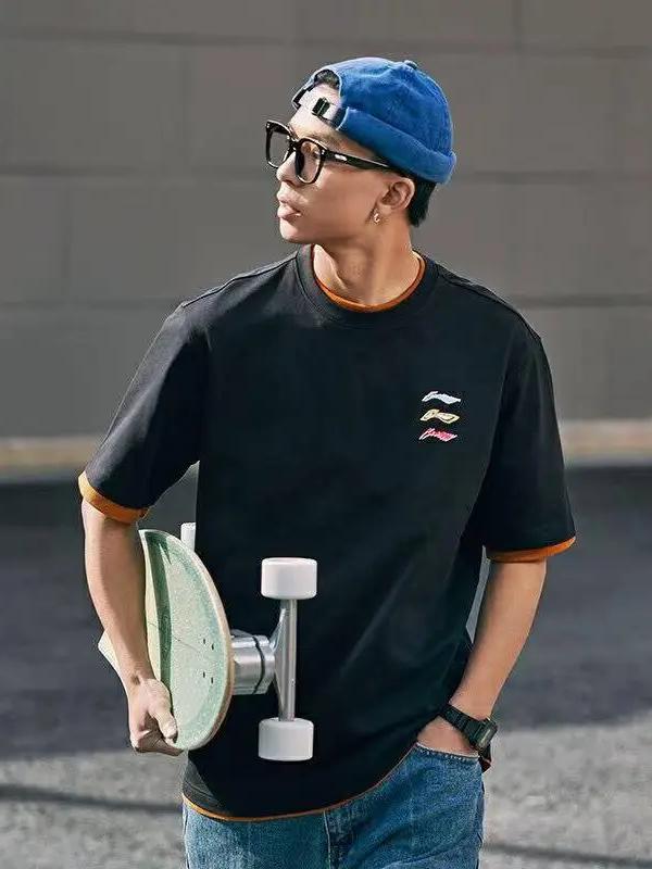 李宁 T恤 运动生活系列涂鸦印花针织棉涤耐洗冰感排汗吸湿排湿美式棉质冰丝凉爽直筒圆领套头落肩袖短袖T恤 AHSU709 黑