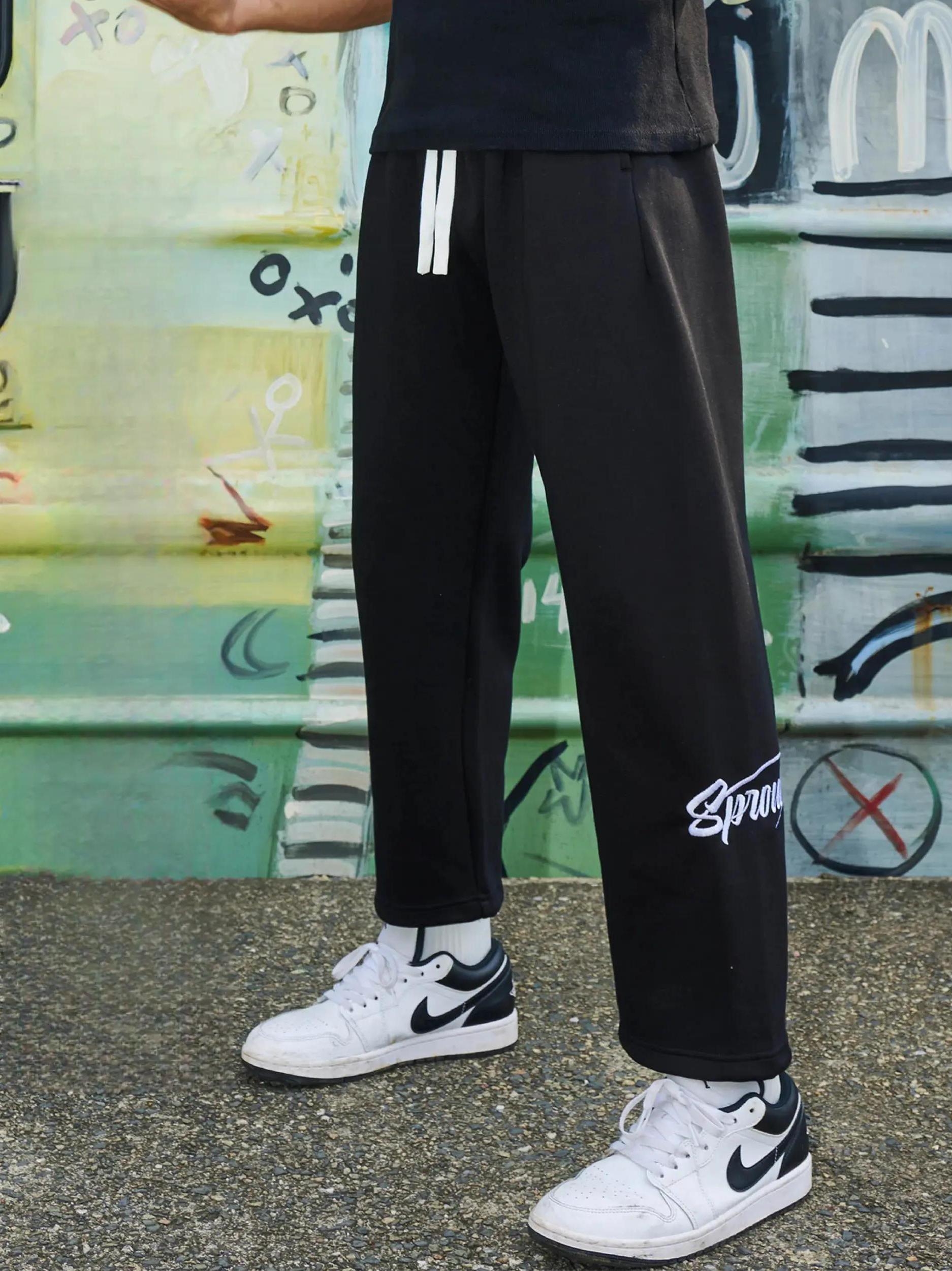 推荐商品：WABRAVE 纯色抽绳直筒运动长裤 WB240215217 黑