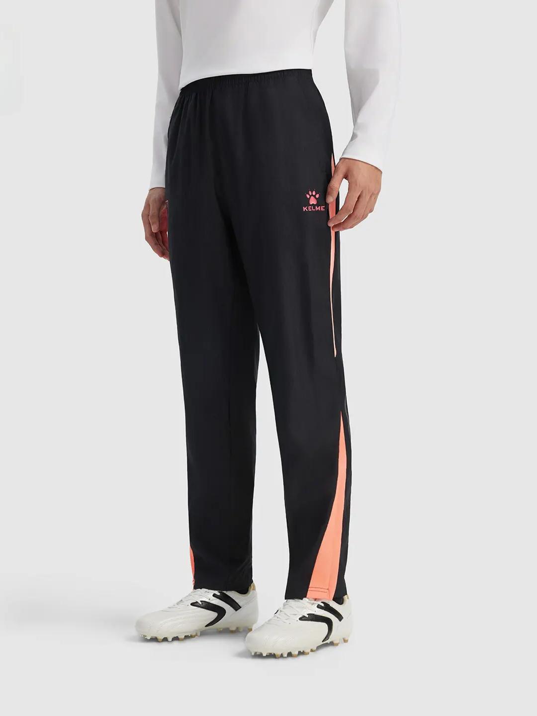 推荐商品：KELME/卡尔美 2026AW 速干防泼水收腿梭织足球裤 9621CK1207 黑/荧光橙