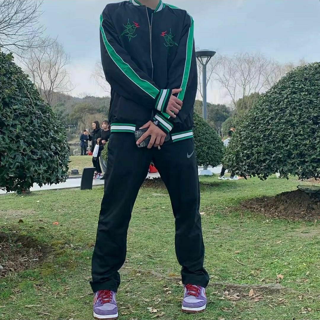 Nike Dri-FIT 小勾运动梭织直筒长裤 927381